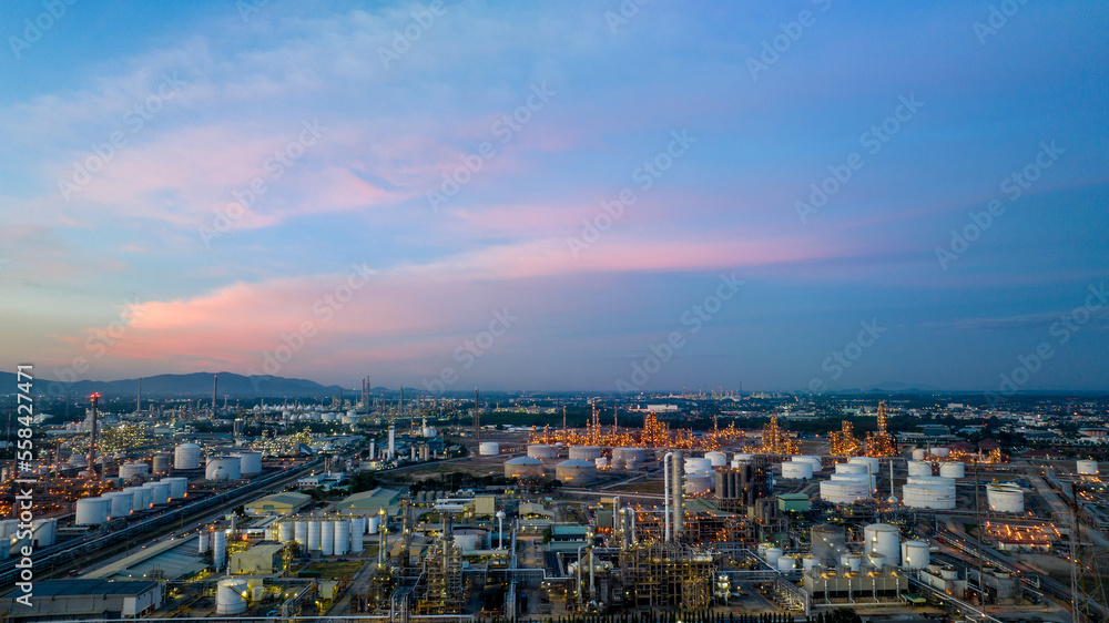 Oil and gas refinery plant or petrochemical industry on blue sky sunset background, Factory at twilight time, Gas furnace and smoke stack in petrochemical industrial Oil and gas refinery plant or petrochemical industry on blue sky sunset background, Factory at twilight time, Gas furnace and smoke stack in petrochemical industrial