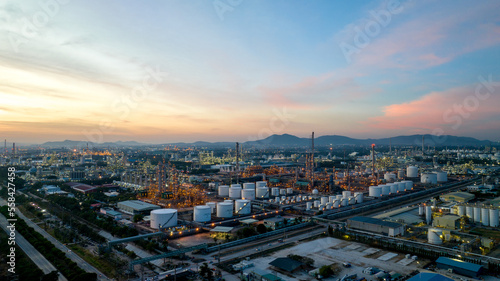 Oil and gas refinery plant or petrochemical industry on blue sky sunset background, Factory at twilight time, Gas furnace and smoke stack in petrochemical industrial