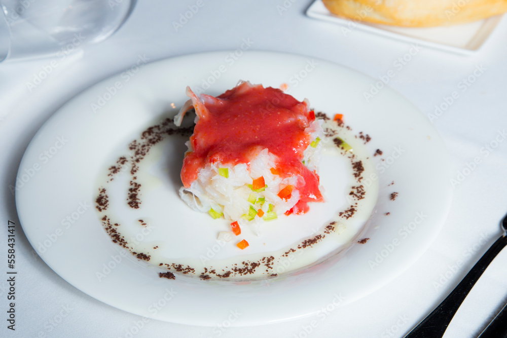 Shredded cod dish with tomato sauce and escarole. Traditional Spanish tapa salad. Shredded cod dish with tomato sauce and escarole. Traditional Spanish tapa salad.