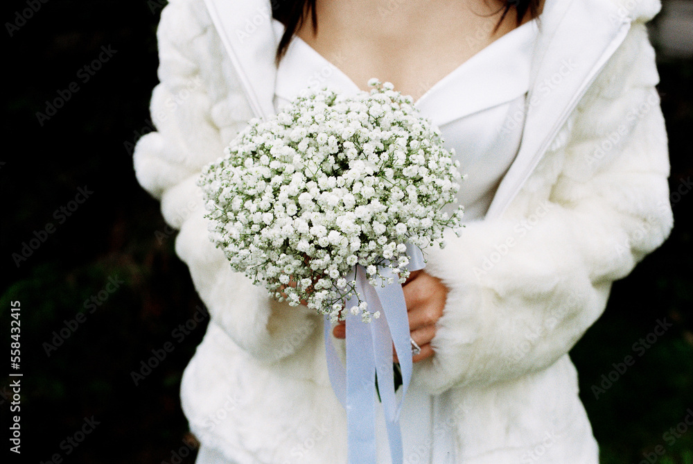 Wedding bouquet in the hands of the bride Wedding bouquet in the hands of the bride