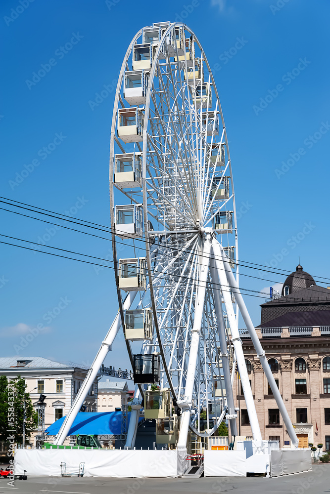 Ferris wheel. Ferris wheel in the city square. Attraction for tourists