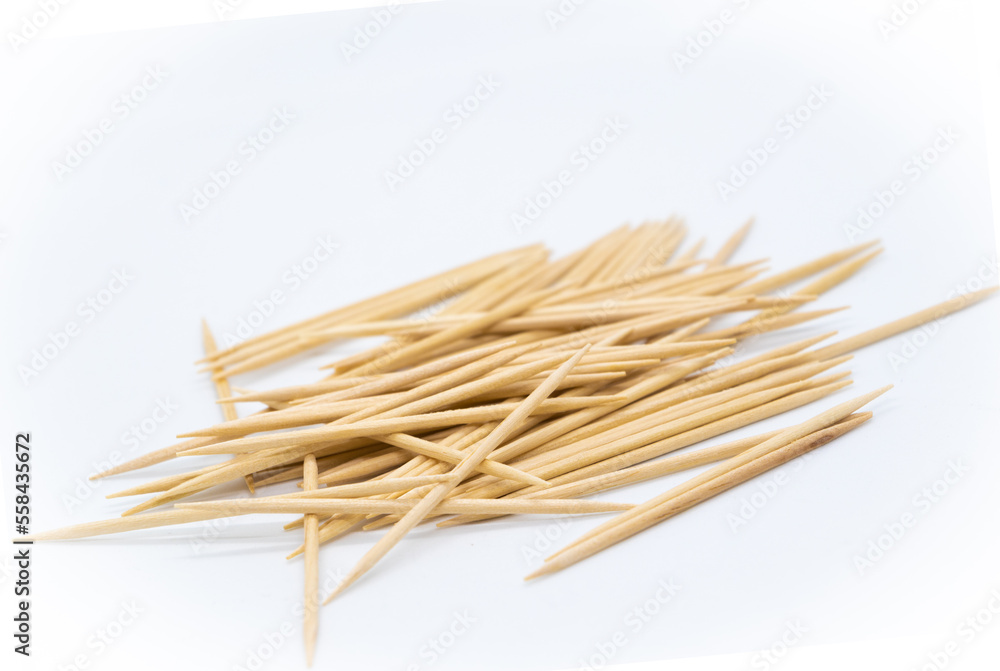 Many toothpicks on a white background