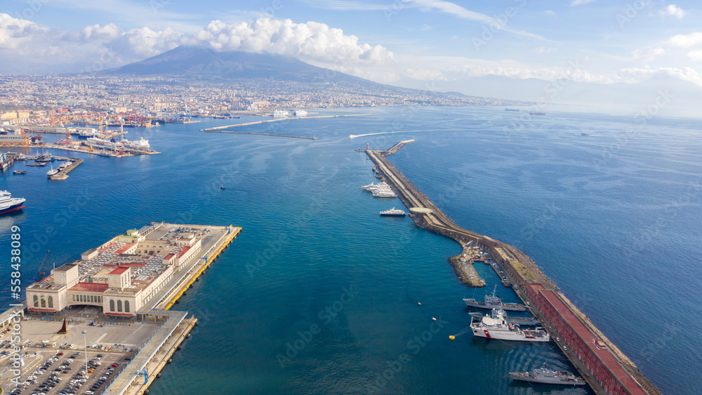 Aerial view of the port of Naples, Italy. In the background the Vesuvius volcano which dominates the panorama.