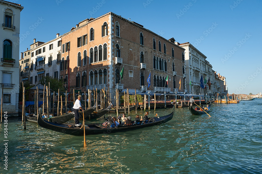 Two gondolas carrying tourists along the Grand Canal at Venice