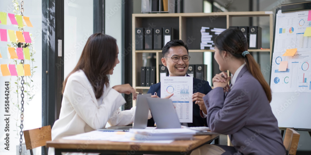Group of young asian modern people in smart casual wear having a brainstorm meeting. Group of young asian business people discussing in the meeting. Group of young asian modern people in smart casual wear having a brainstorm meeting. Group of young asian business people discussing in the meeting.