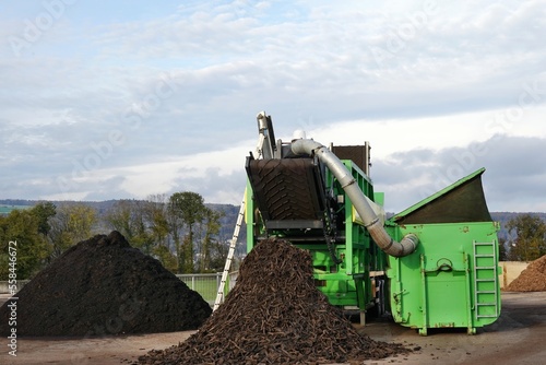 Green starscreen machine is producing biomass or reduces organic material so that it can be composted and returned back into material circulation.  photo