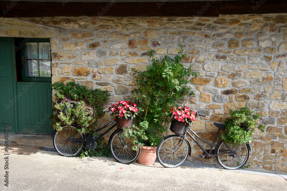 bicycles decorating the facade of a house