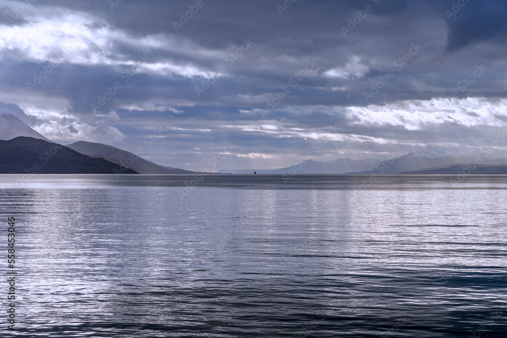Fototapeta premium Small boat in the distance on the open sea