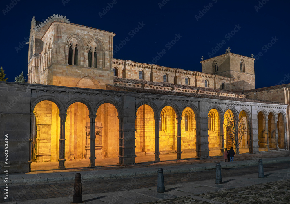Romanesque church of San Vicente illuminated at night in the capital of Avila