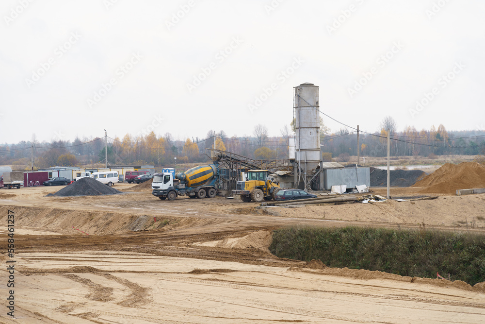 A concrete mixer stands at a modern concrete plant on loading A concrete mixer stands at a modern concrete plant on loading