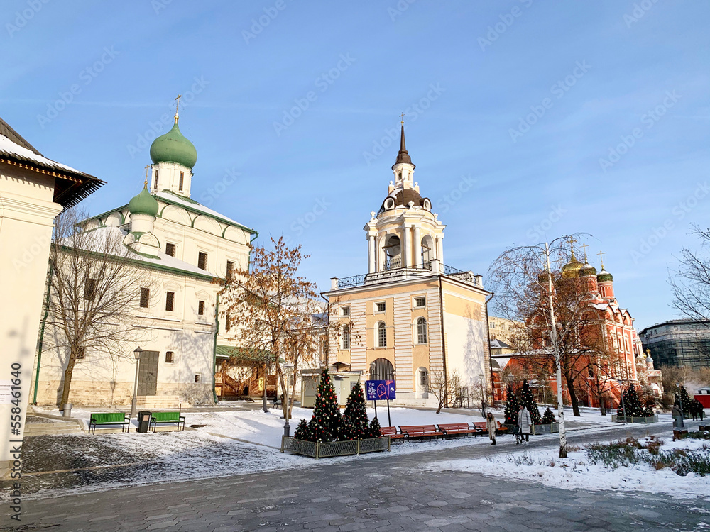 Moscow, Russia, December, 04, 2022. Bell tower of Znamensky monastery and church of Maxim the blessed (1698-1699 years built) on Varvarka street in winter