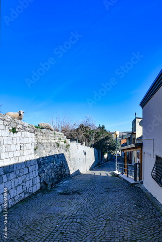 A narrow street among the old houses of Rapolla, a village in the province of Potenza in Italy. photo