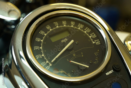 Round speedometer and fuel gauge in the motorcycle tank.