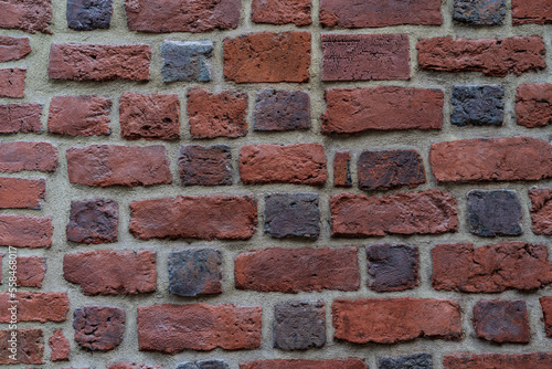 A photo of an ancient brick wall fragment, suitable for use as a phone or computer wallpaper, and also useful for graphic designers looking for vintage or historical elements.