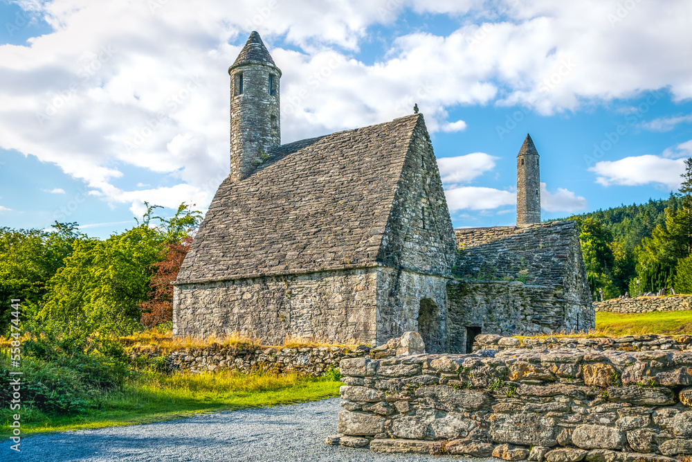 View on small medieval christian St. Kieran Church during sunny day, Glendalough, Ireland