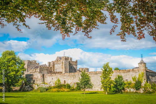 Cahir castle with its massive ramparts observed from the castle park, Ireland