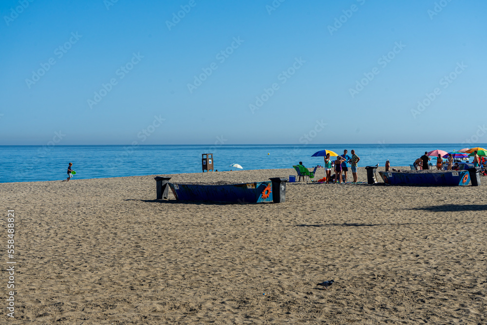 Men preparing meat on BBQ in Fuengirola, Spain on September 17, 2022 Men preparing meat on BBQ in Fuengirola, Spain on September 17, 2022