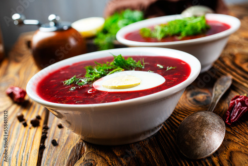 Traditional Ukrainian Russian borscht . Bowl of red beet root soup borsch with white cream . Beet Root delicious soup . Traditional Ukrainian food cuisine photo