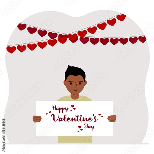 Happy little boy holding a poster with text Happy Valentine's Day and red hearts. Love concept. Happy Valentine's Day wallpaper, poster, postcard or congratulation.