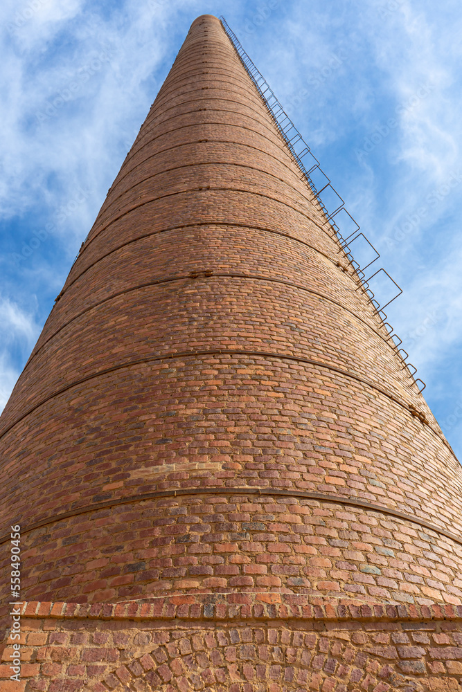 Old factory chimney in Malaga, Spain on October 10, 2022