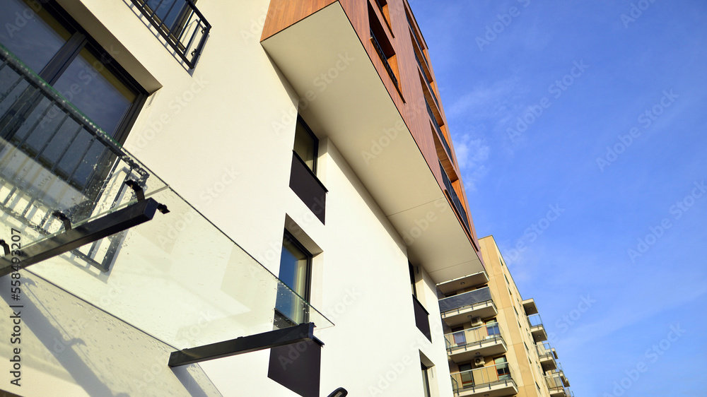 Fototapeta premium Apartments in residential complex. Housing structure at modern house. Architecture for property investment. and architecture details. Urban abstract - windows of apartment building.