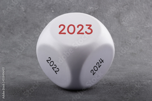 Game dice with the inscription 2022, 2023 and 2024. New year business concept.