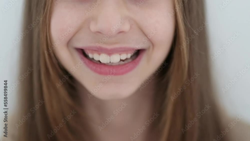 Slow motion video with a smiling little girl with a long hair Slow motion video with a smiling little girl with a long hair