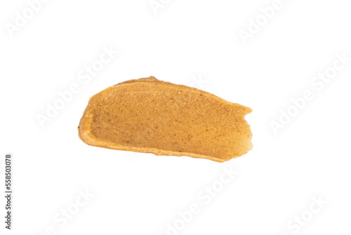 Smears of delicious peanut butter on a white background. Isolated image.