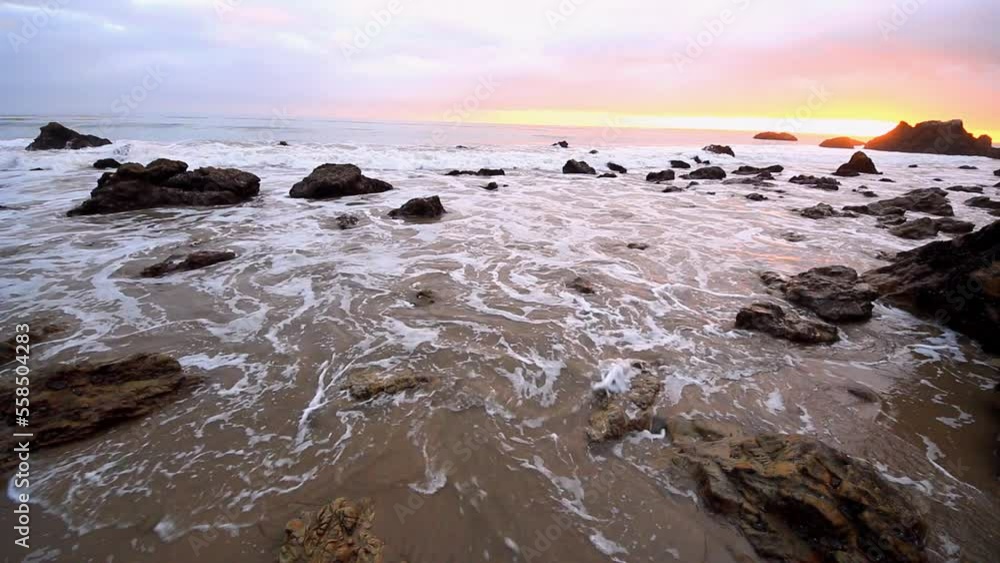 Storm surge and rushing sea foams on Malibu Beach, Los Angeles, California, USA Storm surge and rushing sea foams on Malibu Beach, Los Angeles, California, USA