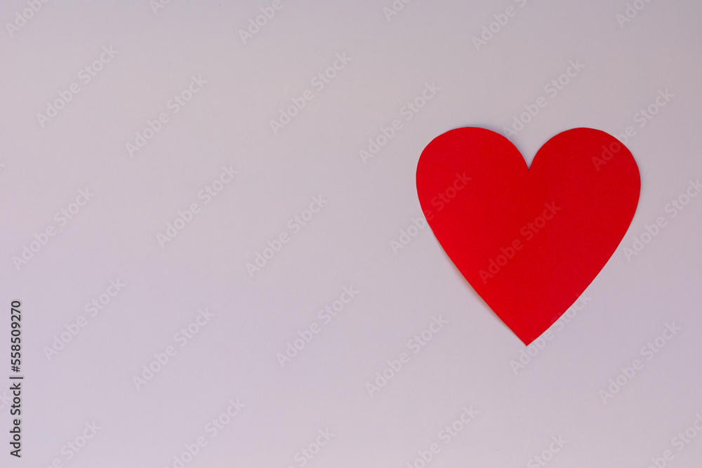 Paper craft heart on a pink background. Valentine flat lay with red heart. Paper craft heart on a pink background. Valentine flat lay with red heart.