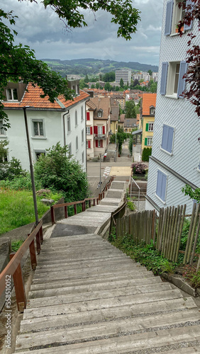 Stairs in a city, Swiss city, stairs leading into a city, stairs leading into a Swiss city, stairs leading into a town, Stairs in a town, stairs leading into a village, stairs in a village