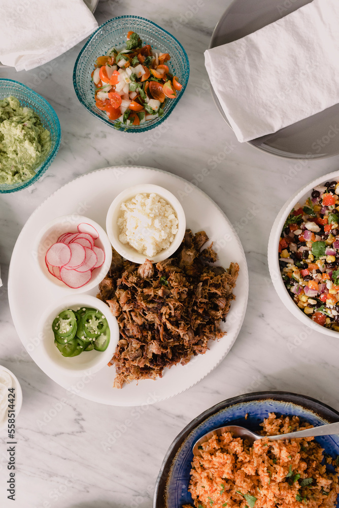 High angle view of food served in plates on table High angle view of food served in plates on table