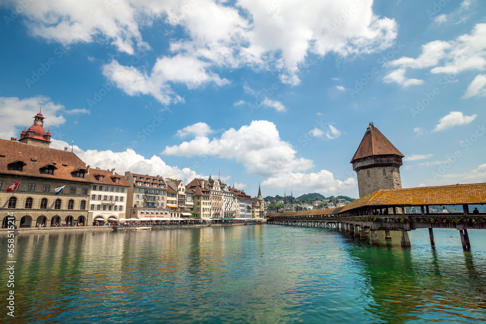 Historic city center of Lucerne with famous Chapel Bridge with blue sky and clouds, Canton of Lucerne, Switzerland