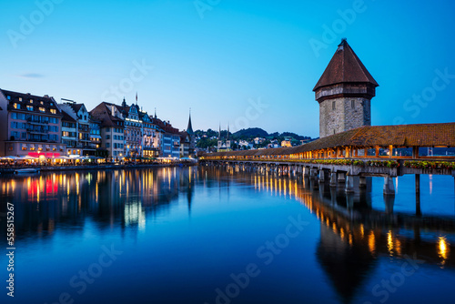 Historic city center of Lucerne with famous Chapel Bridge with blue sky and clouds at twilight, Canton of Lucerne, Switzerland