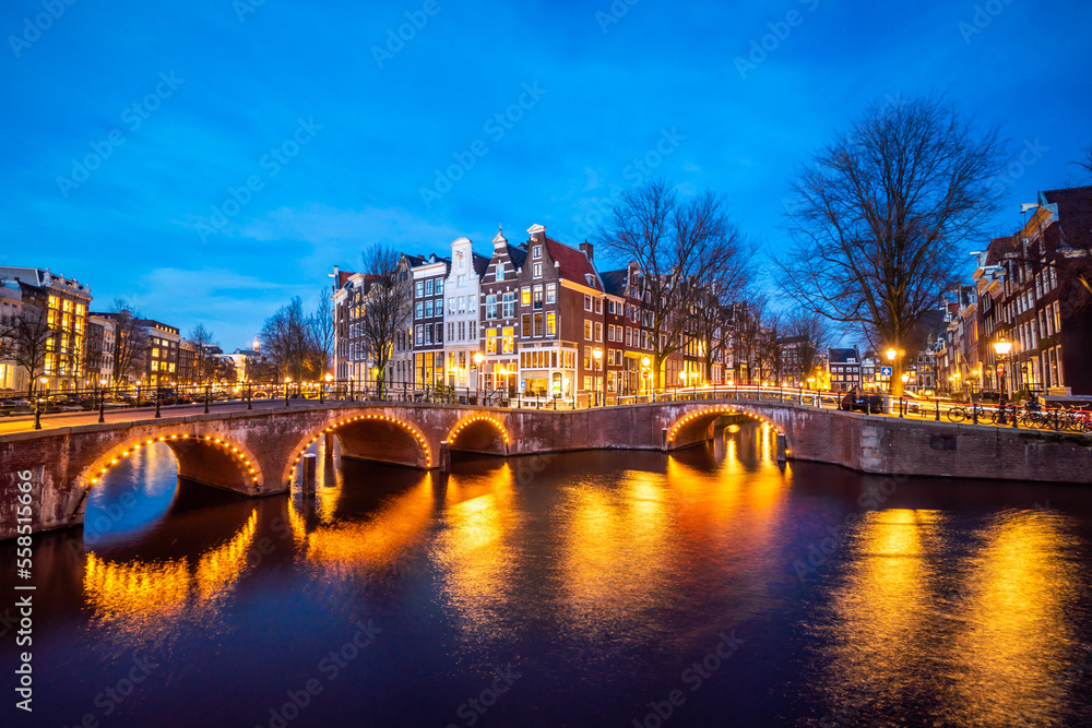 Amsterdam canal at twilight in winter, Amsterdam is the capital and most populous city in Netherlands. Amsterdam canal at twilight in winter, Amsterdam is the capital and most populous city in Netherlands.