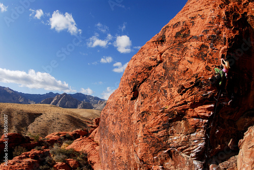 Woman rock climbing at Red Rocks National Recreation Area, Las Vegas, Nevada. photo