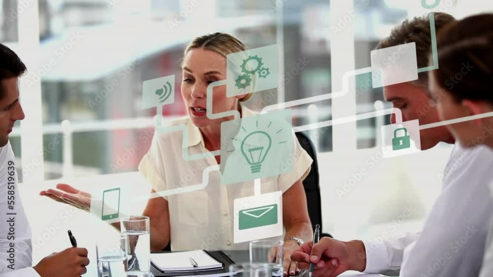 Animation of icons and data processing over diverse business people in office Animation of icons and data processing over diverse business people in office