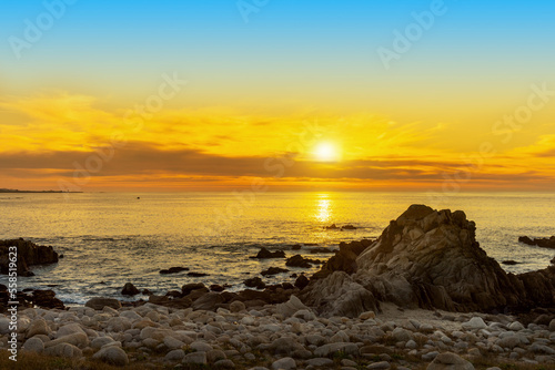 A golden sunset from the coast of Monterey Bay in California