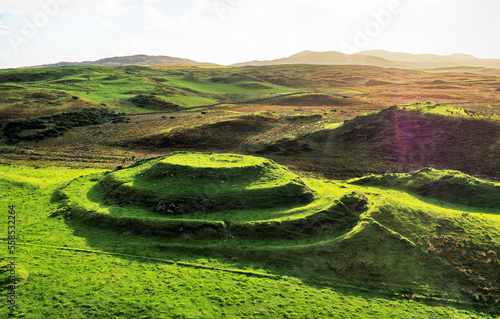Dun Guaidhre multivalate prehistoric Iron Age fort hillfort. Kilmeny, Islay, Inner Hebrides, Scotland. Aerial. Looking East photo