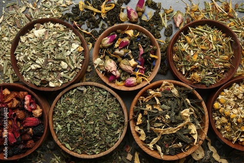 Flat lay composition with different dry teas on table