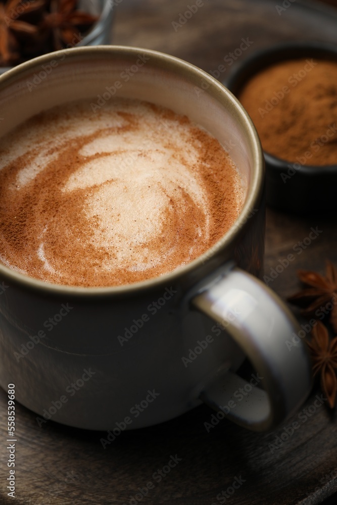 Cup of delicious eggnog on wooden table Cup of delicious eggnog on wooden table