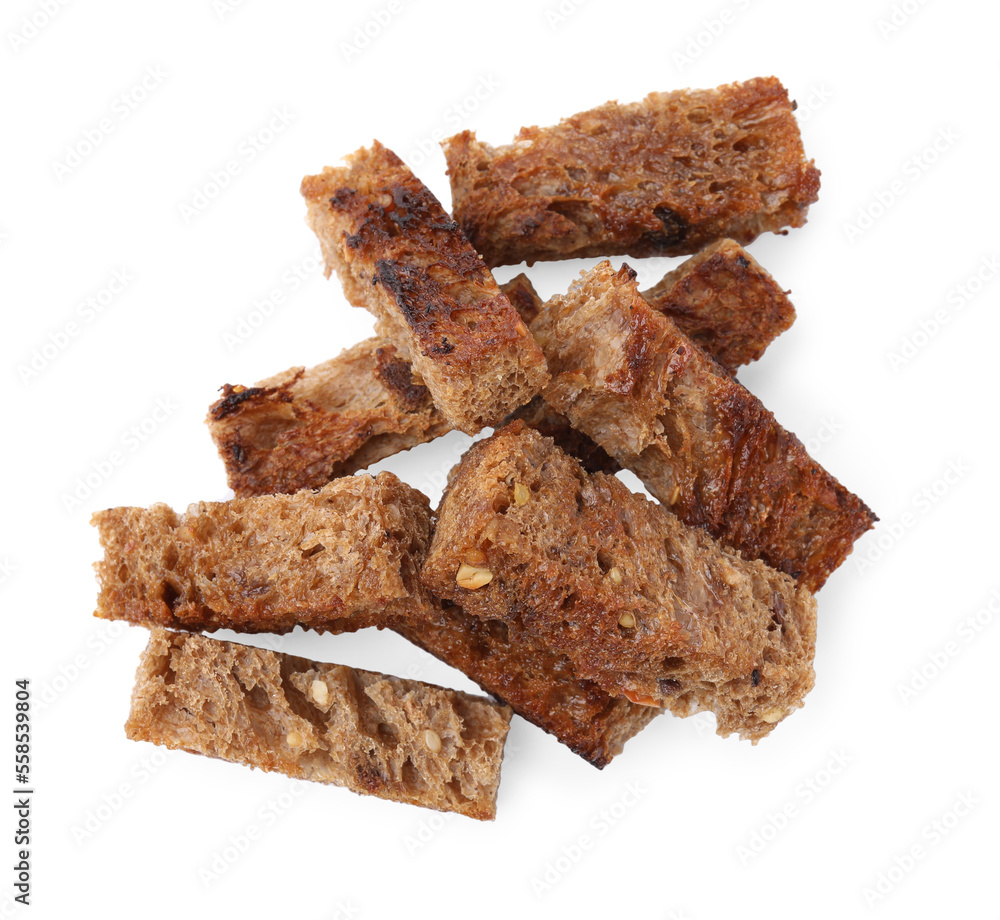 Heap of crispy rusks isolated on white, top view