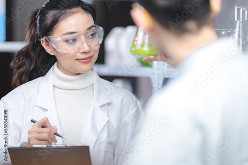 Scientist wearing glasses a...