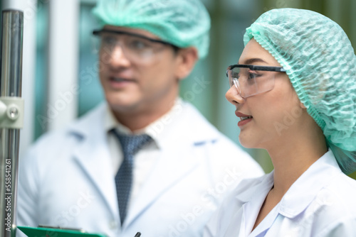 Scientist wearing glasses a...