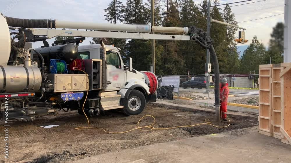 Expert crew uses hydrovac truck to safely expose underground utility line Expert crew uses hydrovac truck to safely expose underground utility line