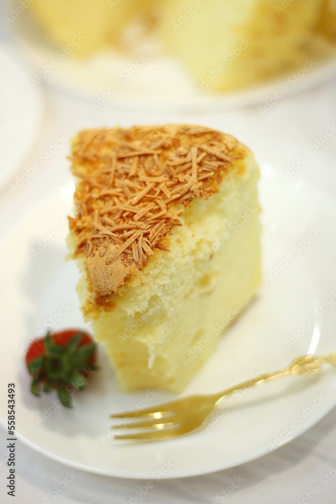 Slice of delicious cheese spongecake isolated on white. Slice of delicious cheese spongecake isolated on white.