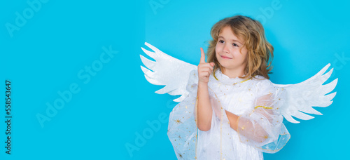 Valentines day banner. Cute child with angel wings. Studio portrait of angel child on studio color isolated background with copy space. Panoramic banner, wide poster, horizontal header.