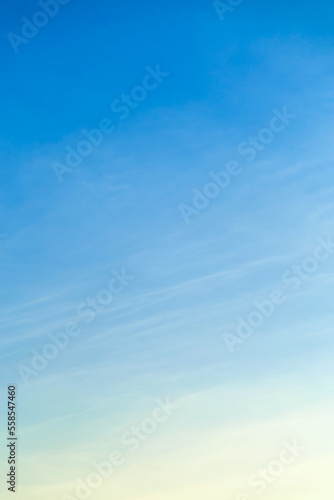 Vetical image awhite clouds in blue sky for background