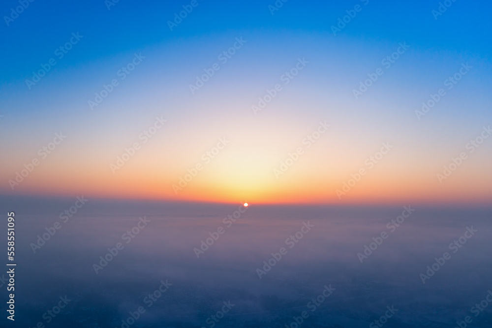 Fototapeta premium A wonderful dawn above the clouds. Natural background