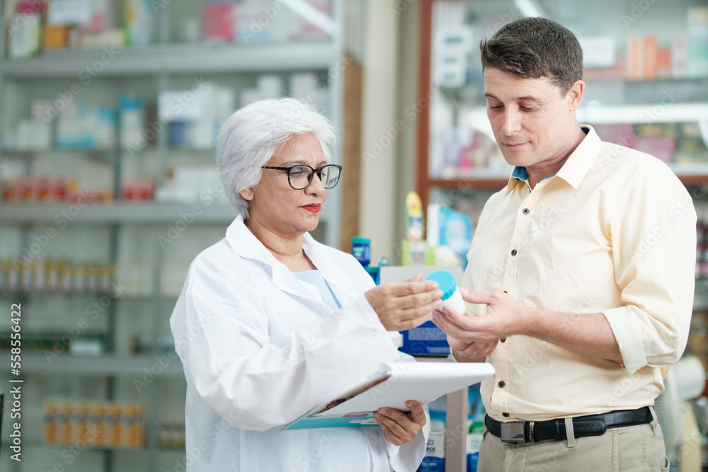 Pharmacist talking to a client about prescribed medications.
